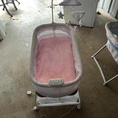 Delta Children Smart Sleep Auto Glide Pink & White Bassinet with Bluetooth