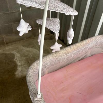 Delta Children Smart Sleep Auto Glide Pink & White Bassinet with Bluetooth