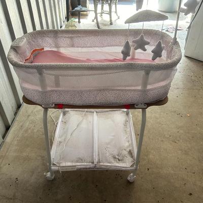Delta Children Smart Sleep Auto Glide Pink & White Bassinet with Bluetooth