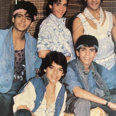 Menudo band signed magazine page