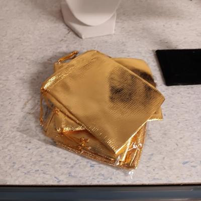 JEWELRY DISPLAYS AND GOLD DRAWSTRING BAGS