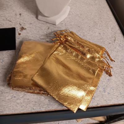 JEWELRY DISPLAYS AND GOLD DRAWSTRING BAGS