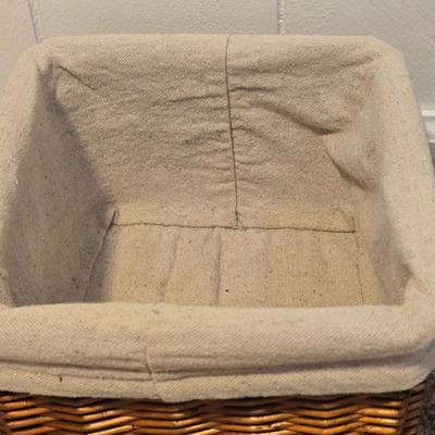 A Wicker Basket with Liner and Plastic Basket