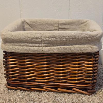 A Wicker Basket with Liner and Plastic Basket