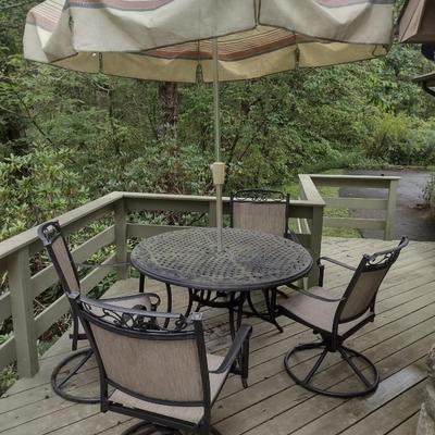 Wrought Metal Five Piece Patio Set with Swivel Style Chairs includes Umbrella