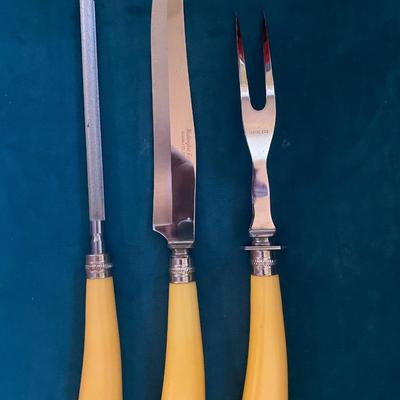 Vintage butterscotch bakelight carving set