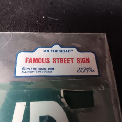 ELVIS MUSIC BOX, CARDBOARD STREET SIGN AND A TIN