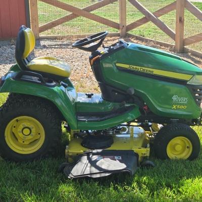 JOHN DEERE 4 Rivers X 580 with 54" Accel Deep Deck with John Deere Tiller, John Deere Snow Blower, and Yardworks Lawn Sweeper