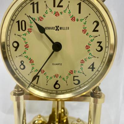Howard Miller Clock Gold Tone Rotating Pendulum Glass Dome