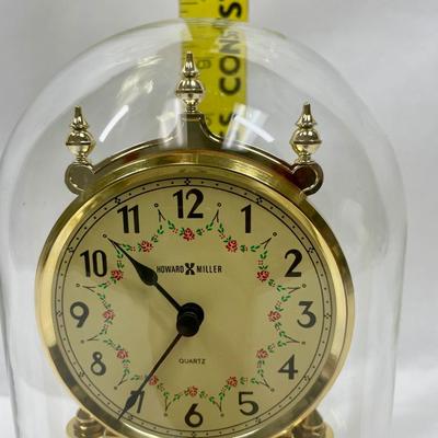 Howard Miller Clock Gold Tone Rotating Pendulum Glass Dome