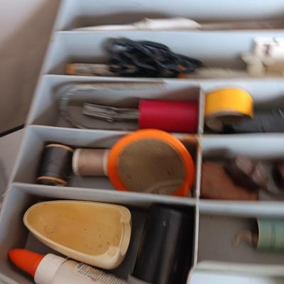 Variety of household hardware in divided organizing case