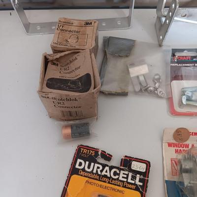 Variety of household hardware in divided organizing case