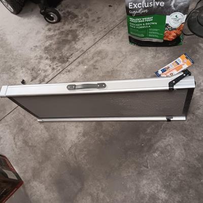 EXTENDABLE PET RAMP, PARTIAL BAG OF DOG FOOD AND ORAL HYGIENE KIT