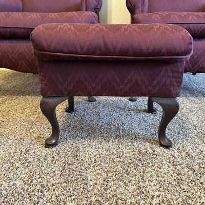 2 BURGUNDY WING BACK CHAIRS AND 1 OTTOMAN