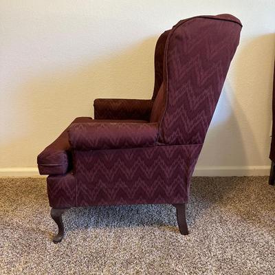 2 BURGUNDY WING BACK CHAIRS AND 1 OTTOMAN