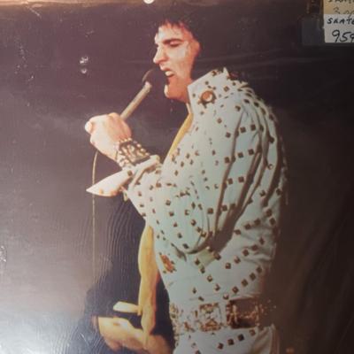 PHOTO OF ELVIS WITH HIS PARENTS AND A PICTURE OF ELVIS