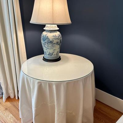 Round table with custom upholstered fabric (matches the sofa and chair) with glass top
