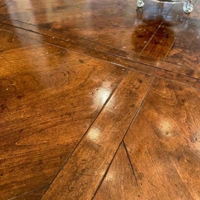 Oval wood dining table and six freshly upholstered chairs