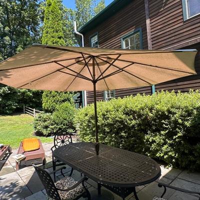 Outdoor metal table with two chairs and Pottery Barn umbrella