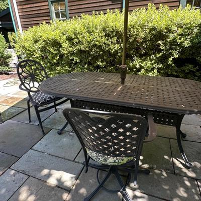 Outdoor metal table with two chairs and Pottery Barn umbrella