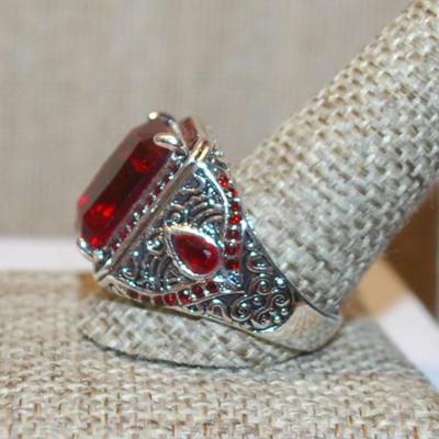 Size 12¼ Large Red Emerald Cut Stone Ring with Red Side Stone Accents on a Solid Silver Tone Band (10.7g)
