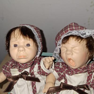 3 babies on a bench