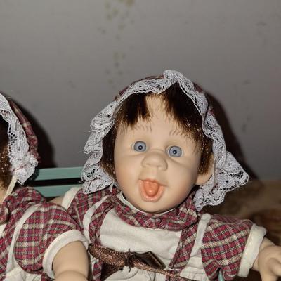 3 babies on a bench