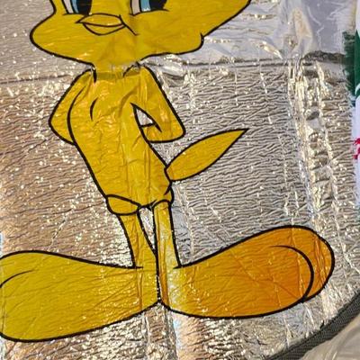 Cartoon memorabilia watch including Batman glasses and Bugs Bunny items