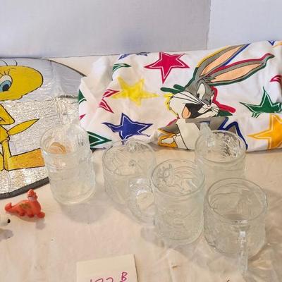 Cartoon memorabilia watch including Batman glasses and Bugs Bunny items