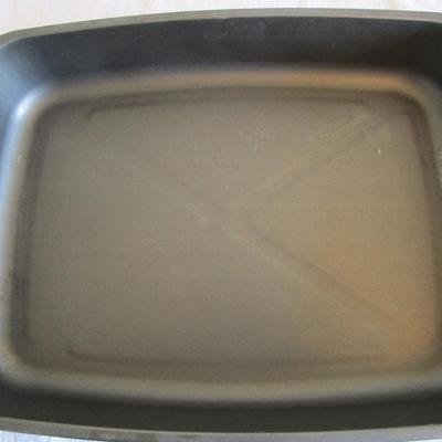 Roasting pan with rack and spring pan