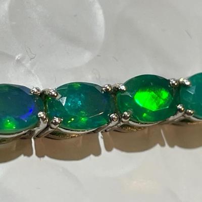 Vintage Simulated Emerald Tennis Bracelet in Sterling Silver 7.25" Long in Good Preowned Condition.