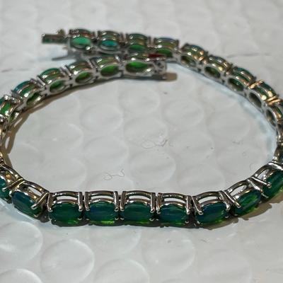 Vintage Simulated Emerald Tennis Bracelet in Sterling Silver 7.25" Long in Good Preowned Condition.