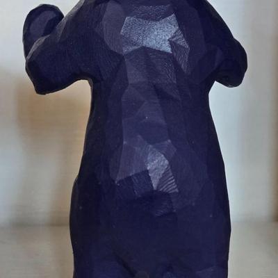 Blue Bear that Looks like he is Holding Up Books, Objects, Ect.