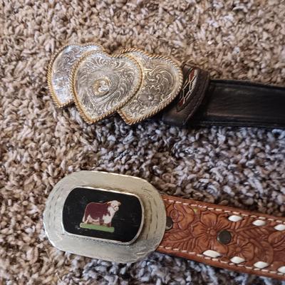 2 LEATHER BELTS WITH 2 MONTANA SILVERSMITH BELT BUCKLES