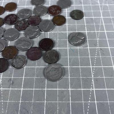 Unsearched Pile of Coins; Silver Dime, Wheat Pennies and old Nickels From Piggy Bank