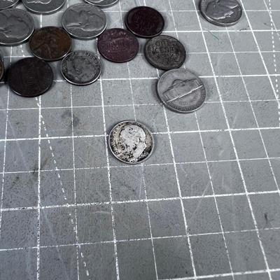 Unsearched Pile of Coins; Silver Dime, Wheat Pennies and old Nickels From Piggy Bank
