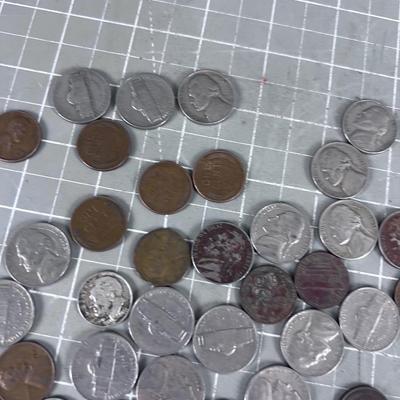 Unsearched Pile of Coins; Silver Dime, Wheat Pennies and old Nickels From Piggy Bank