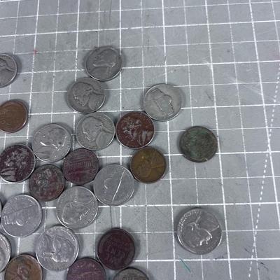Unsearched Pile of Coins; Silver Dime, Wheat Pennies and old Nickels From Piggy Bank