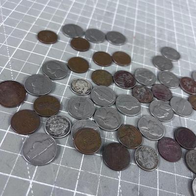 Unsearched Pile of Coins; Silver Dime, Wheat Pennies and old Nickels From Piggy Bank