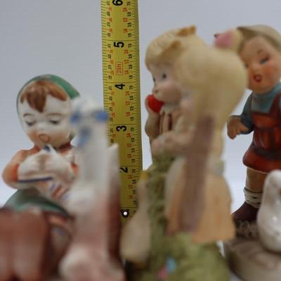 Vintage Figurines of Children on Fences