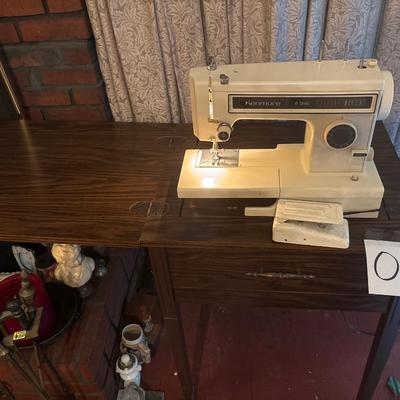 Sewing machine with table