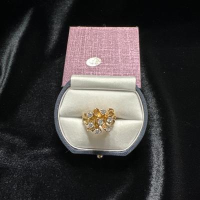 A ladies ring,cocktail style in 14kt gold. Set in the head are 7 full diamonds w/ the total weight of .75 carat.