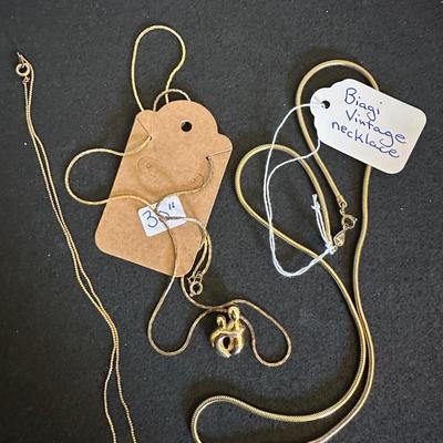 Three gold tone necklaces