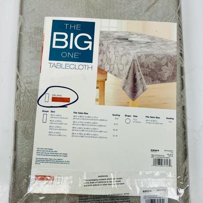 New in Package Tablecloth oblong 60” x 102” gray poly/cotton blend
