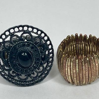 Vintage Rings - Gold tone stretch ring and Black Sundial stretch Ring