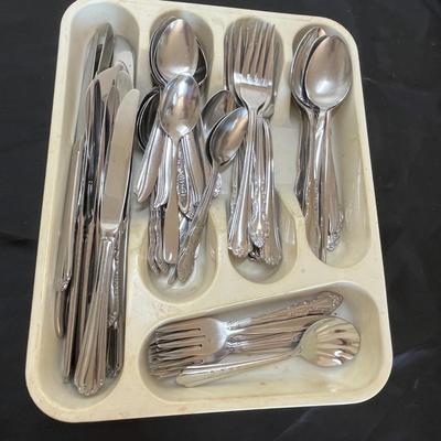 Tray of stainless steel flatware