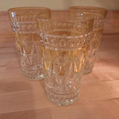 4 yellow MCM tumblers
