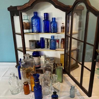 Vintage Display Cabinet with Old Medicine Bottles