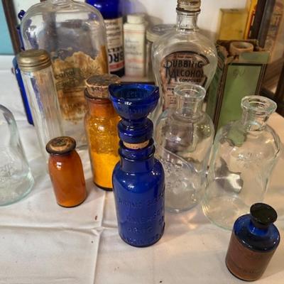 Vintage Display Cabinet with Old Medicine Bottles