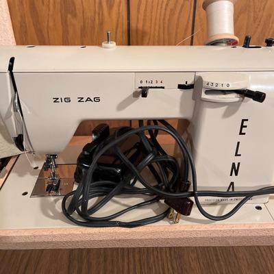 Vintage Necchi Elna portable sewing machine with stand